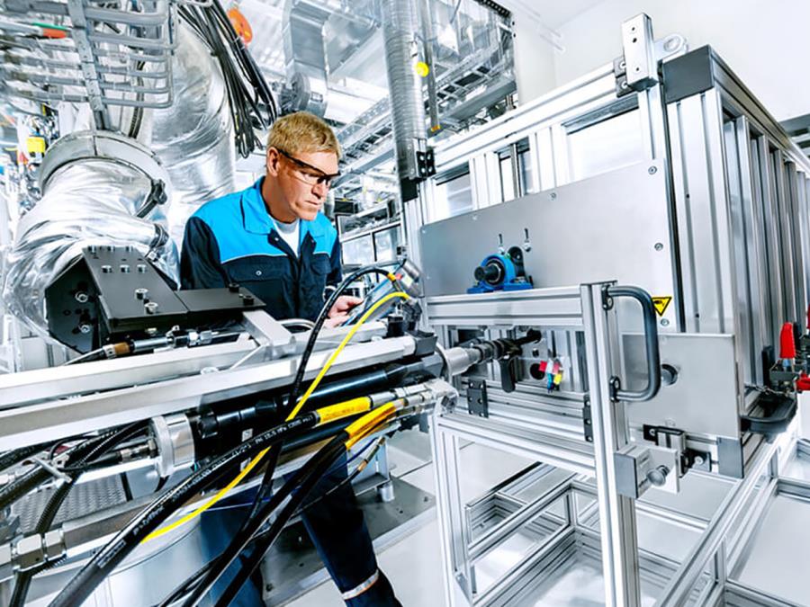 An employee working on a machine at the Polyurethane technical center.