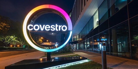 View of the Covestro logo in front of the Leverkusen site