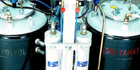 View of two gas tank cylinders connected to different pipes and valves.